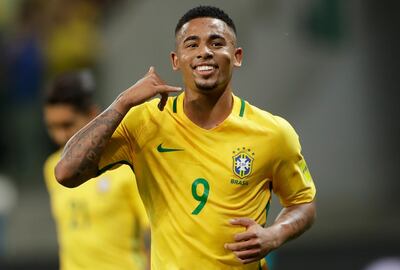 In this Oct. 10, 2017 photo, Brazil's Gabriel Jesus celebrates with his famous "Alo Mae" pretend phone call to his Mom, after scoring against Chile, during a World Cup qualifying soccer match in Sao Paulo, Brazil. (AP Photo/Andre Penner)