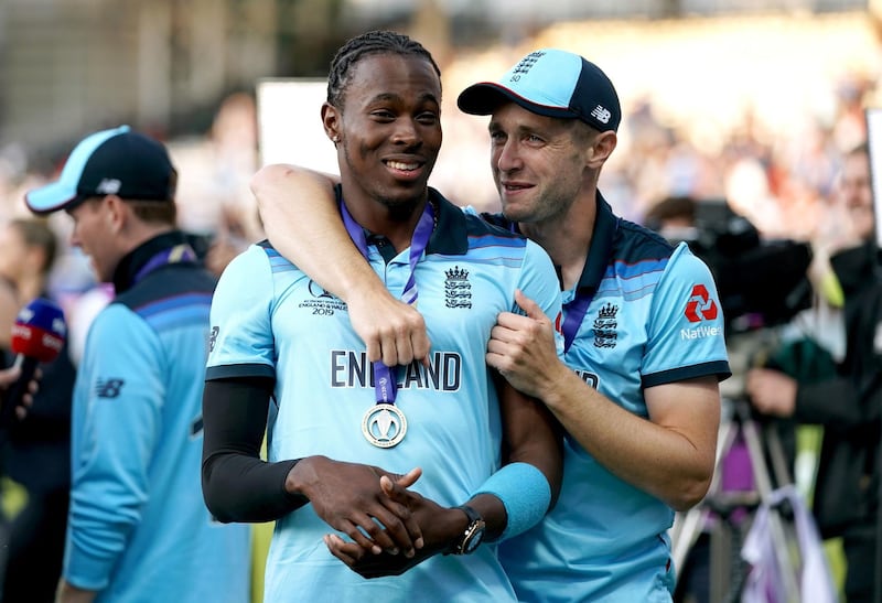 File photo dated 14-07-2019 of England's Jofra Archer (left) and Chris Woakes celebrate winning the ICC World Cup Final at Lord's, London. PA Photo. Issue date: Saturday April 25, 2020. England paceman Jofra Archer revealed he has “gone mad” searching for his World Cup winner’s medal after losing it during a recent house move. See PA story CRICKET England.  Photo credit should read John Walton/PA Wire.