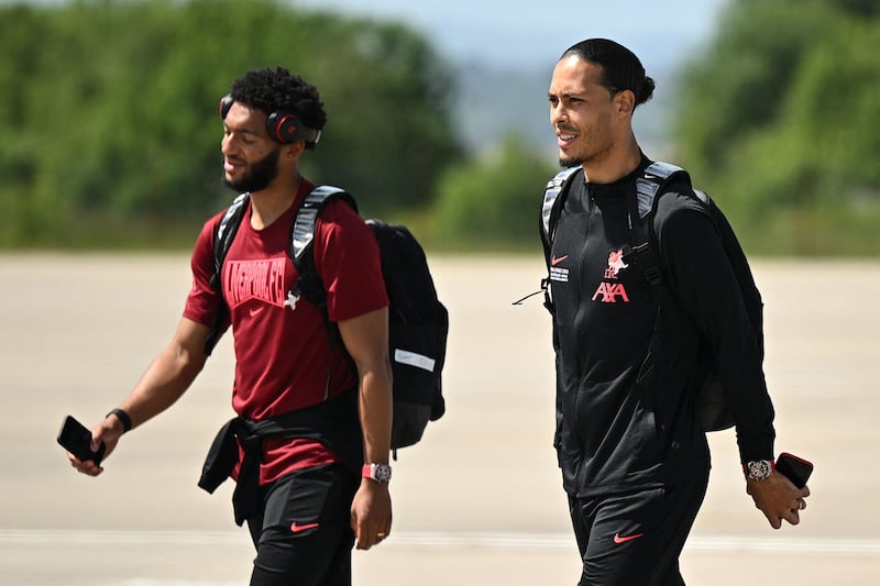 Joe Gomez and  Virgil van Dijk at the John Lennon Airport before their departure to Paris on Friday. AFP