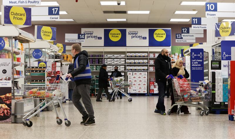 Shoppers in the UK are buying less and switching to cheaper brands, Tesco said, as the cost of living soars. REUTERS