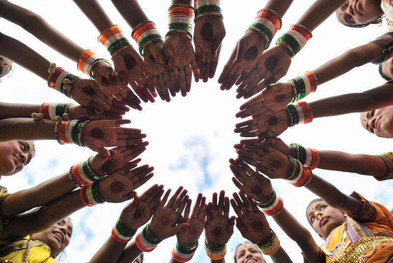 Indian girls wear tri colour bangles  during Independence Day celebrations in Secunderabad. Noah Seelam / AFP Photo