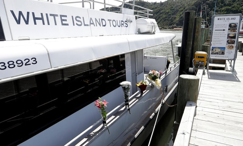 Bouquets of flowers sit on one of the two tour boats that went to White Island on December 9 in Whakatane, New Zealand. AP Photo