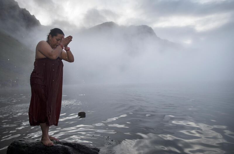 A devotee takes a holy dip in the cold Gosaikunda Lake. Narendra Shrestha/EPA