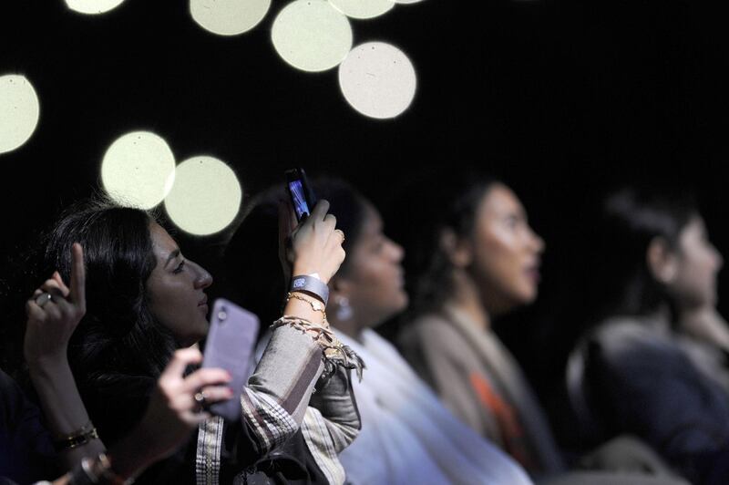Saudi women take a selfie as they attend a concert by Egyptian pop sensation Tamer Hosny. Amer Hilabi / AFP
