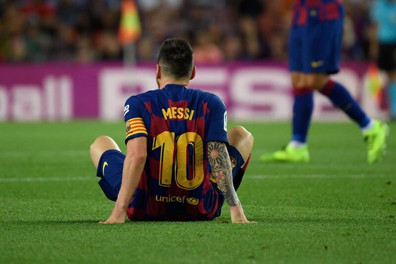 Barcelona's Argentine forward Lionel Messi waits to receive medical treatment for an injury. AFP