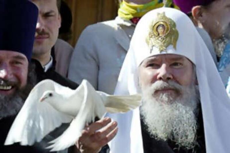 Patriarch Alexiy II releases a dove after a holiday service in the Kremlin in Moscow.