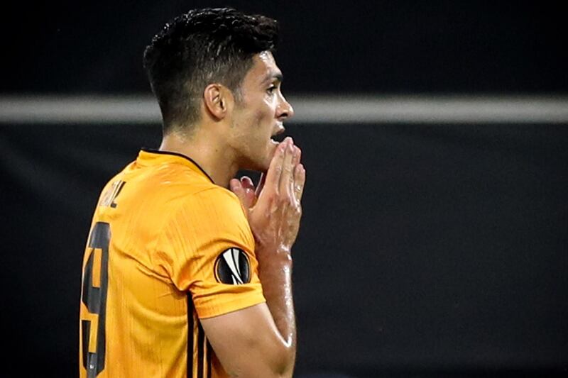 Raul Jimenez reacts after missing a penalty during the Europa League quarter final against Sevilla in Duisburg, Germany. EPA