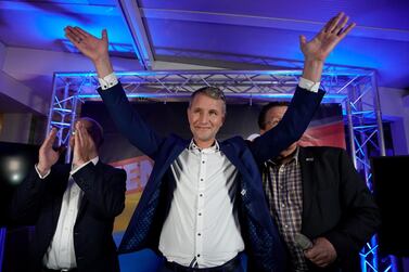  Thuringia chairman and top candidate of the Alternative for Germany (AfD) right-wing populist party Bjoern Hoecke (C) cheers next to AfD Brandenburg chairman Andreas Kalbitz (L) and AfD Bundestag member Stephan Brandner (R) on the evening of the Thuringia state elections at an AfD event in Erfurt, Germany, 27 October 2019. EPA/RONALD WITTEK