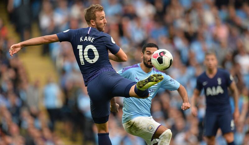 Tottenham Hotspur's Harry Kane (L) controls the ball during the English Premier League soccer match between Manchester City and Tottenham Hotspurs at the Etihad Stadium in Manchester, Britain.  EPA