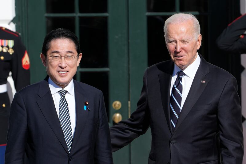 President Joe Biden greets Japanese Prime Minister Fumio Kishida at the White House in Washington. AP