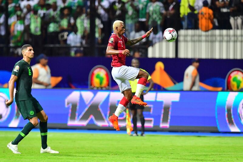 Madagascas forward Charles Andriamahitsinoro jumps for the ball. AFP