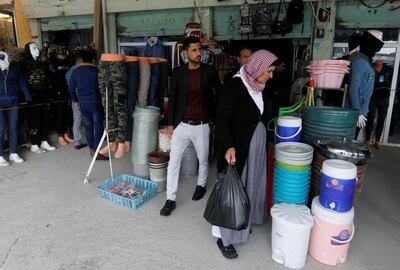 People from the minority Yazidi sect shop at a market in Sinjar, Iraq December 1, 2020. REUTERS/Khalid al-Mousily