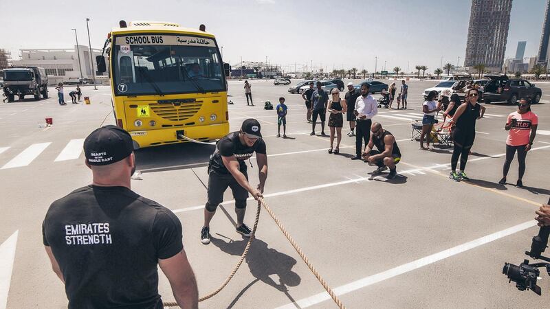 Male and female participants were tasked to pull trucks 30 metres in the fastest time possible. Courtesy Emirates Strength