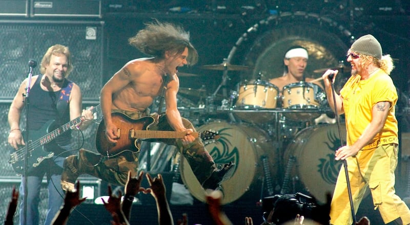 Members of the rock group Van Halen (L-R) bassist Michael Anthony, guitarist Eddie Van Halen, drummer Alex Van Halen and singer Sammy Hagar, performs during the first of two-sold-out shows at the Mandalay Bay Events Center in Las Vegas, Nevada late August 6, 2004. The band is touring in support of the new two-disc compilation "The Best of Both Worlds." Picture taken August 6. REUTERS/Ethan Miller  EM