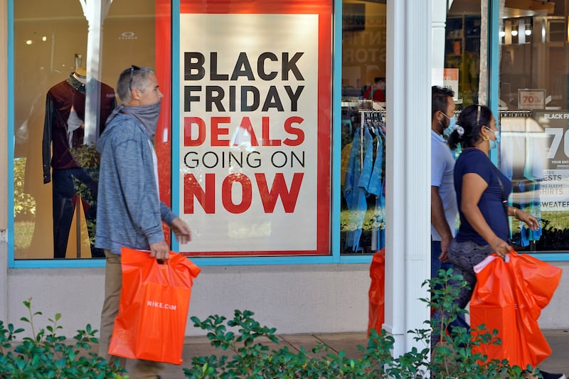 Shoppers wear protective face masks as they look for Black Friday deals at an outlet store store in Ellenton, Florida. AP