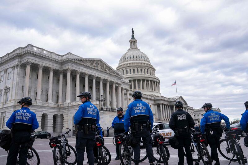 Capitol Police guard the perimeter of the compound. Getty / AFP