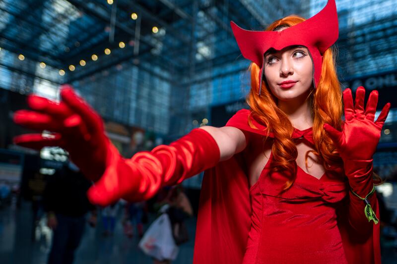 An attendee dressed as Wanda Maximoff poses during New York Comic Con. Charles Sykes / Invision / AP