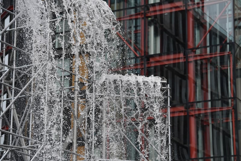 Danish-Icelandic artist Olafur Eliasson's work 'Waterfall' (2019) sits outside the Tate Modern. Photo: EPA