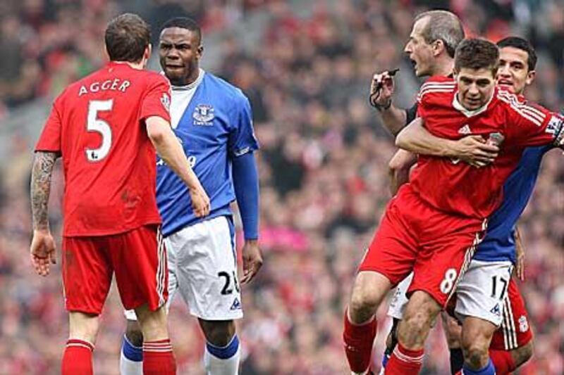 Victor Anichebe, the Everton striker, squares up to Liverpool’s Daniel Agger after a challenge as Steven Gerrard is pulled away by Tim Cahill during last season’s match at Anfield. These are familiar scenes when it comes to the Merseyside derby.