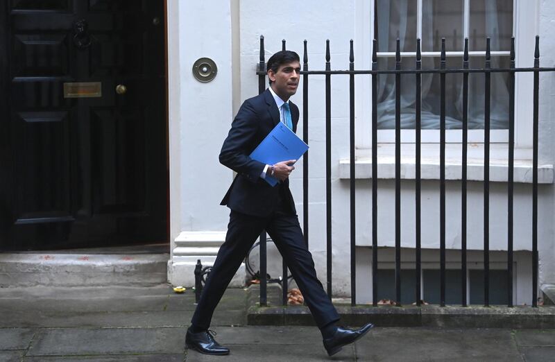epa08840822 Britain's Chancellor of the Exchequer Rishi Sunak leaves 11 Downing Street ahead of announcing his annual; spending review in Parliament London, Britain 25 November 2020. Sunak will unveil the government's spending plans for the coming year. The Spending Review includes details on public sector pay, NHS funding and money for the devolved administrations in Northern Ireland, Scotland and Wales.  EPA/NEIL HALL