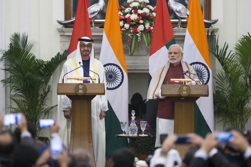 Sheikh Mohammed bin Zayed, Crown Prince of Abu Dhabi Deputy Supreme Commander of the UAE Armed Forces, left, with Indian prime minister Narendra Modi at the signing of several deals in New Delhi. Philip Cheung / Crown Prince Court - Abu Dhabi