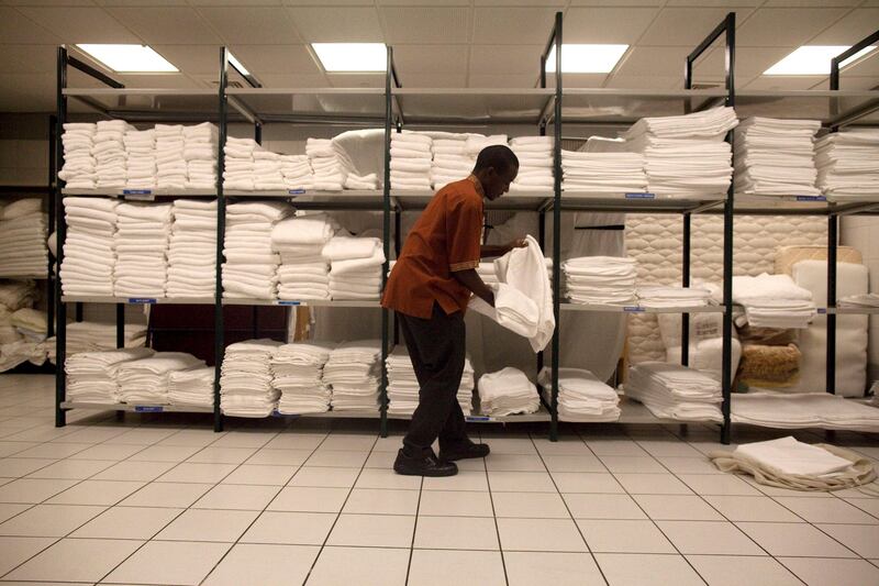 Abu Dhabi, United Arab Emirates, July 15, 2013:     A man works in the linen closet at Emirates Palace in Abu Dhabi on July 15, 2013. Christopher Pike / The National

Reporter: GILLIAN DUNCAN *** Local Caption ***  CP0715-emirates palace012.JPG