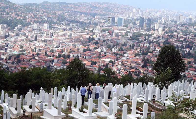 Bosnian Muslims visit Ravne Bakije cemetery during the second day of Eid Al Adha, in Sarajevo, Bosnia and Herzegovina.