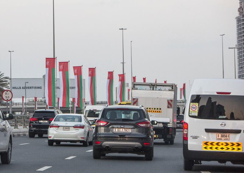 Dubai, United Arab Emirates- Omani flags on display at Sheikh Zayed Road roundabout.  Leslie Pableo for The National
