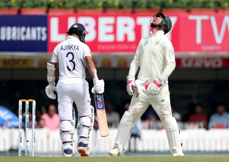 South Africa wicketkeeper Heinrich Klaasen, right, celebrates after taking the catch to dismiss India's Ajinkya Rahane. AP