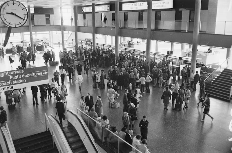 Passengers queue at the check-in counters in 1966