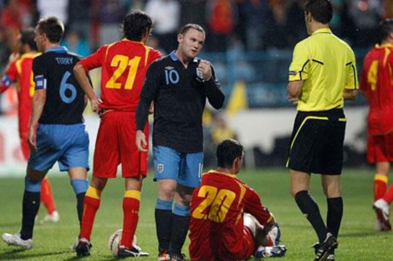 Wayne Roone, centre, has been sent off twice in 73 appearances during his England career.