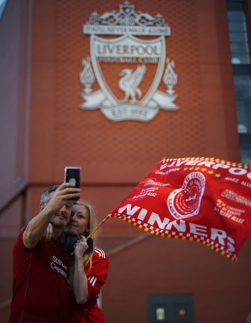 Liverpool fans celebrate outside Anfield stadium. EPA