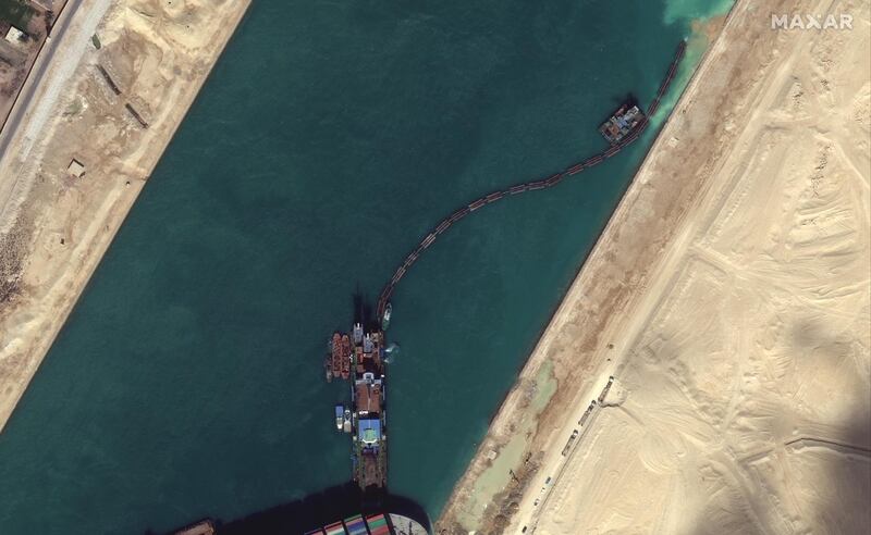 A view of the dredging operations which continue near the Ever Given container ship in Suez Canal in this Maxar Technologies satellite image. Reuters