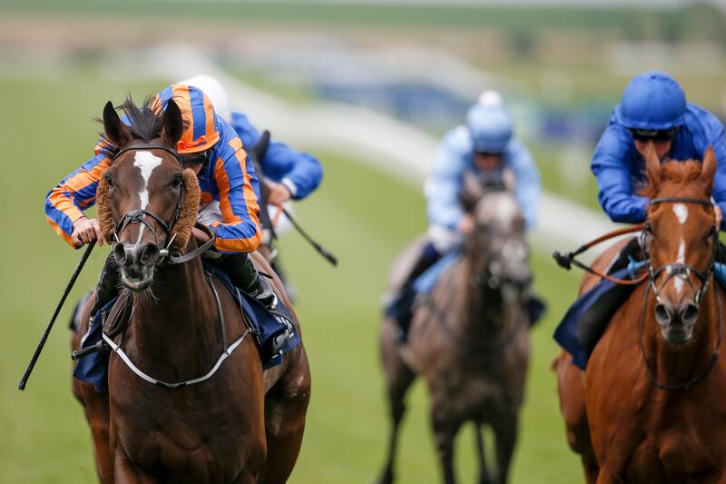 NEWMARKET, ENGLAND - JULY 14:  Ryan Moore riding Roly Poly (L) win The tattersalls Falmouth Stakes from Wuheida (R, blue) at Newmarket racecourse on July 14, 2017 in Newmarket, England. (Photo by Alan Crowhurst/Getty Images)