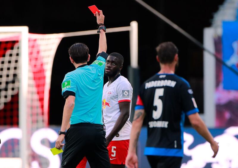 Leipzig's Dayot Upamecano is shown a red card by referee Deniz Aytekin. EPA