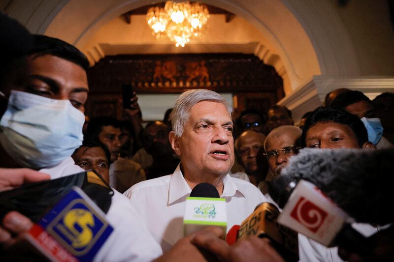 Ranil Wickremesinghe leaves a Buddhist temple in Colombo after he was named as Sri Lanka's eighth executive president. Reuters