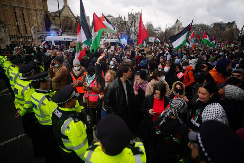 Metropolitan Police officers form a cordon at Parliament Square to prevent protesters from reaching Westminster Bridge during a Free Palestine Coalition demonstration in London. PA