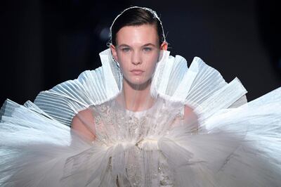 TOPSHOT - A model presents a creation by Giambattista Valli during the 2019 Spring-Summer Haute Couture collection fashion show in Paris, on January 21, 2019. / AFP / Anne-Christine POUJOULAT
