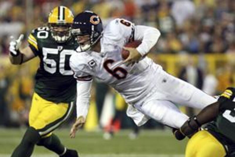 Jay Cutler, No 6, was to be the Bears' saviour but became their downfall, throwing four interceptions in their defeat at Green Bay.