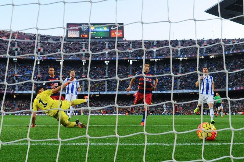 Neymar, left, of Barcelona scores his team’s third goal during the La Liga match with Real Sociedad at Camp Nou in Barcelona.  David Ramos/Getty Images