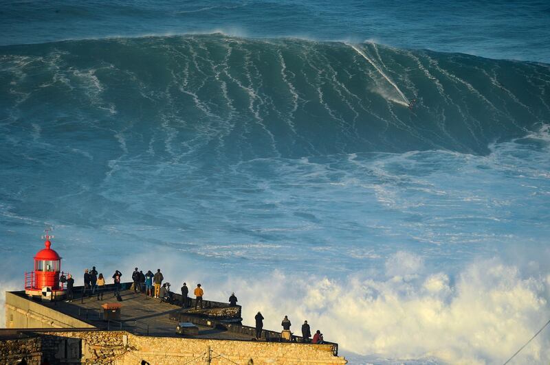 A surfer in action during the big wave event at Praia do Norte, in Nazare, Portugal, on October 29. EPA