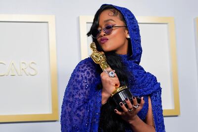 H.E.R., winner of the award for best original song for "Fight For You" from "Judas and the Black Messiah," poses in the press room at the Oscars, in Los Angeles, California, U.S., April 25, 2021. Chris Pizzello/Pool via REUTERS