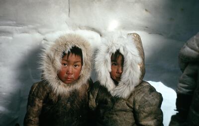 Portrait of two Inuit children inside an igloo, Nunavut, Canada, 1967. Photo taken during the National Film Board of Canada's production of 'The Netsilik Eskimos Series'. (Photo by NFB/Getty Images)