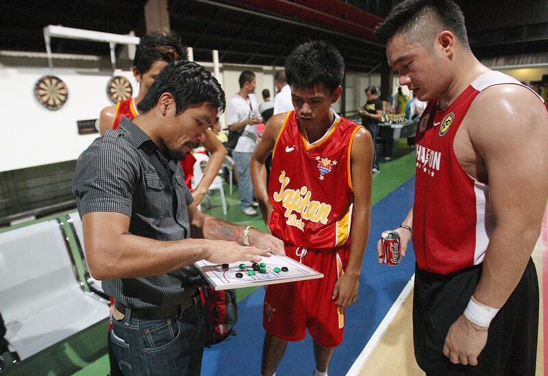 Manny Pacquiao coaches his basketball team in General Santos in late 2013. Mike Young for The National / November 16, 2013