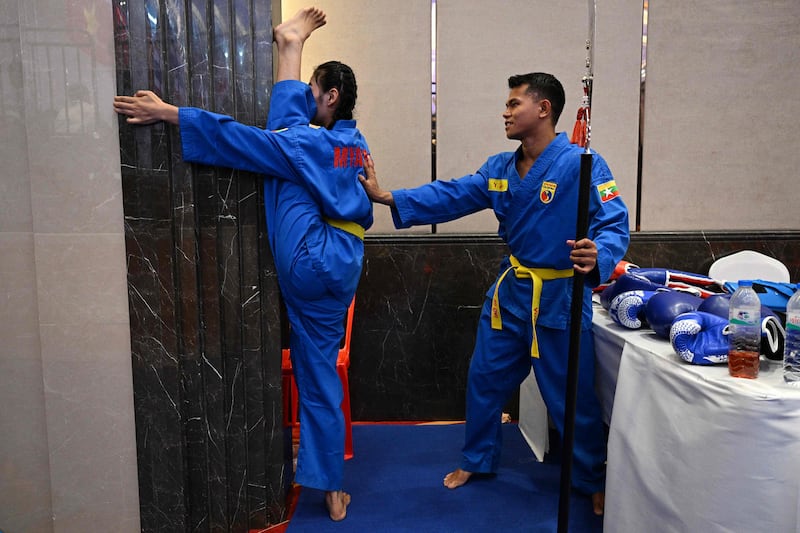 Members of Myanmar's vovinam martial arts team warm up before competing in the 32nd South-East Asian Games in Phnom Penh, Cambodia, on Saturday. AFP