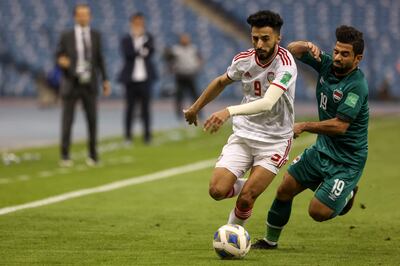 UAE midfielder Bandar Al Ahbabi vies for the ball with Iraq's Hussein Al Saedi. AFP