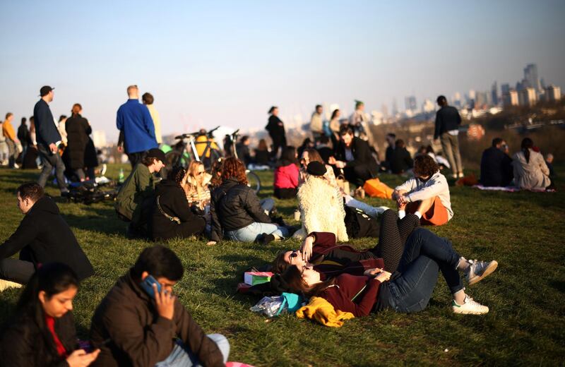 People visit Primrose Hill in London. Reuters