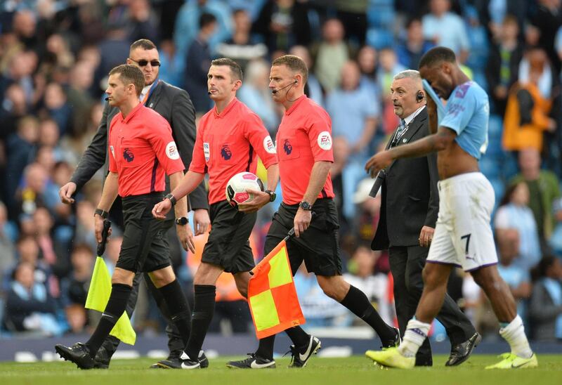 Referee Michael Oliver (3-L) leaves the pitch at the end of the English Premier League soccer match between Manchester City and Tottenham Hotspurs at the Etihad Stadium in Manchester, Britain. EPA