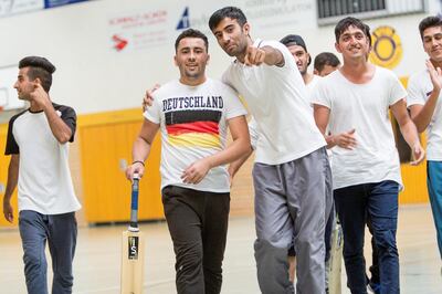 BISCHOFSWERDA, GERMANY - SEPTEMBER 17:  Members of Dresden Cricket Team during a regional tournament of teams from eastern Germany on September 17, 2016 in Bischofswerda, Germany. Most of the teams are strongly populated by migrants and refugees, especially from countries including Pakistan and Afghanistan, who arrived in Germany over the past year and half. Their participation has invigorated cricket in Germany, a country where soccer dominates and many people have never witnessed a cricket match. (Photo by Carsten Koall/Getty Images)