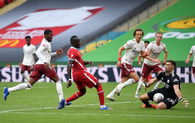 Arsenal goalkeeper Emiliano Martinez saves from Liverpool's Sadio Mane. PA